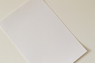 Wall Mural - blank paper sheet on white table