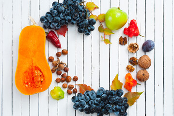 Wall Mural - autumn fruits and vegetables on white wooden