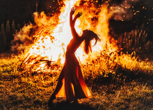 Beautiful Shamanic Woman Dancing By The Fire.