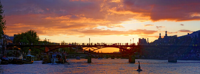 Wall Mural - Sunset over the Arts bridge in Paris, France. Built between 1801 and 1804, it was the first iron bridge in Paris.