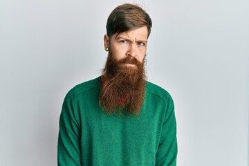 Wall Mural - Redhead man with long beard wearing casual clothes skeptic and nervous, frowning upset because of problem. negative person.