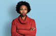 © Krakenimages.com - African american woman with afro hair with arms crossed gesture relaxed with serious expression on face. simple and natural looking at the camera.