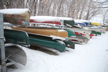 Wall Mural - canoes covered in snow