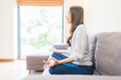 © siraphol - Portrait beautiful young asian woman meditation on sofa