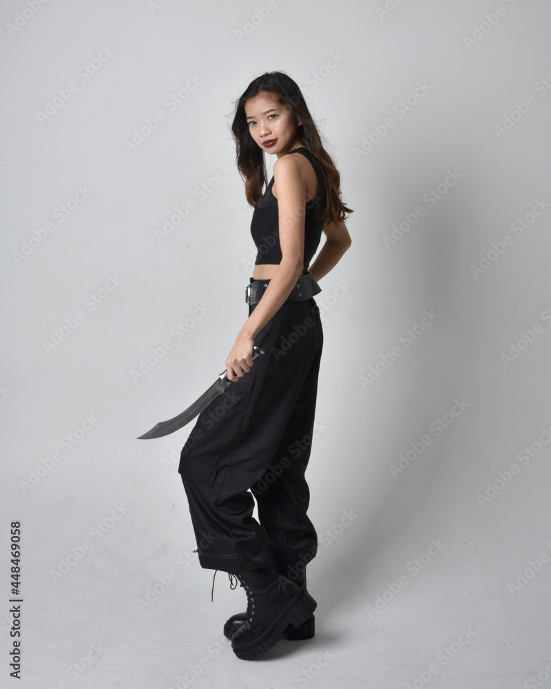 Full length portrait of pretty young asian girl wearing black tank top ...