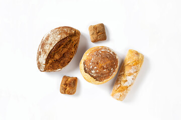 Aufkleber - Bakery. Set of freshly baked crispy bread and buns on white background top view, flat lay