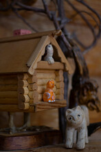 Wooden Craft Birdhouse On The Legs. Figures Of Squirrels And Foxes.