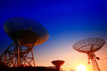 Wall Mural - The silhouette of a radio telescope observatory