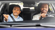 © Syda Productions - driver courses and people concept - happy smiling car driving school instructor teaching young man to drive