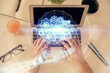 © peshkova - Multi exposure of man's hands typing over computer keyboard and data theme hologram drawing. Top view. Technology concept.