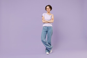 Poster - Full length young smiling happy woman 20s with bob haircut wear white t-shirt looking camera hold hands crossed folded isolated on pastel purple background studio portrait. People lifestyle concept