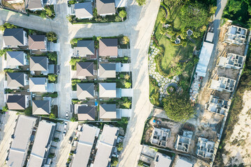 Housing estate or community in aerial view consist of garden, residential building. Real estate or property from land development by construction for sale, rent, buy, purchase, mortgage in Chiang Mai.