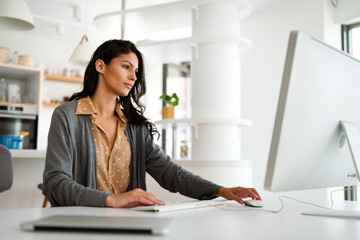 Wall Mural - Attractive business woman working on computer. Business technology people concept.