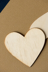 Sticker - wooden hearts on sand brown paper background