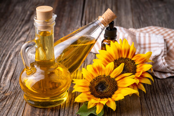 Wall Mural - Sunflower and sunflower oil on the wooden background