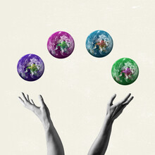 Contemporary Artwork. Human Bw Hands Holding Four Colored Images Of The Earth. Concept Of Saving Nature.