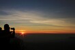 © Memet - silhouette of a person sitting on a bench at sunset