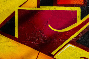 Wall decorated abstract drawings close-up. Detail of graffiti. Modern urban street culture