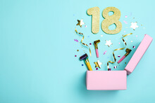 Flat Lay Composition With Decor And Numbers On Light Blue Background, Space For Text. 18th Birthday Party