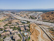Sylmar, CA, LA County, July 27, 2021: Aerial View of Legends At Cascades Condominium Complex Sylmar with freeway interstate 5 and 210
