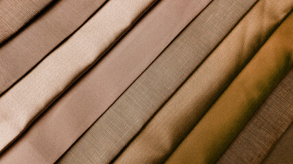 Wall Mural - close up multi brown tone of silk fabric samples in catalog. interior drapery or upholstery material palette background for interior concept. vintage drapery background.