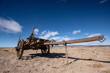 Old Abandoned Farm Wooden Cart Wagon In The Desert