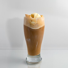 Delicious Soda Fountain Style Old Fashioned Frothy Root Beer Float In A Clear Glass On A White Background.