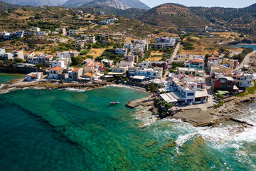 Canvas Print - Aerial view of the Cretan village of Mochlos surrounded by crystal clear blue waters