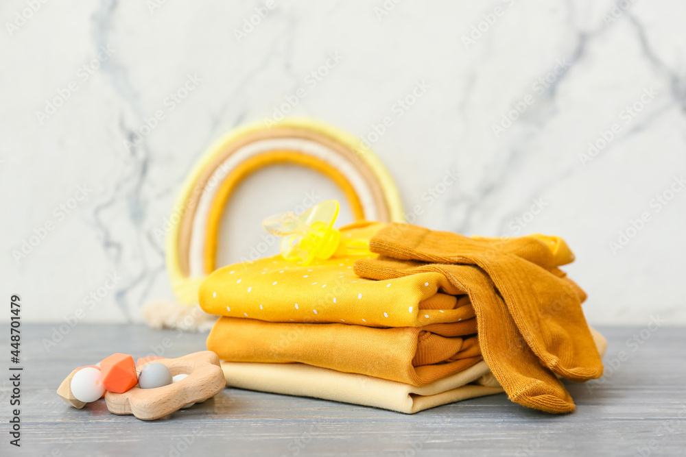Set of baby accessories on wooden table