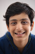 © IndiaPix - CLOSE SHOT OF A SMILING TEENAGE BOY LOOKING AT CAMERA