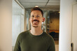 © Jacob Lund - Portrait of smiling entrepreneur in office