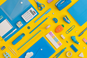 Pattern composition of school stationery on a yellow background. Back to school concept.	