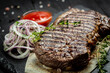 Grilled ribeye beef steak. Dry Aged Barbecue Ribeye Steak on wooden background. banner, menu, recipe place for text, top view