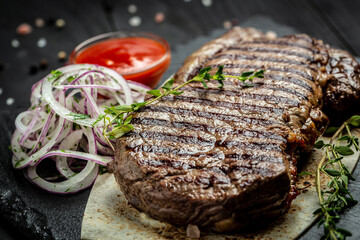 Canvas Print - Grilled ribeye beef steak. Dry Aged Barbecue Ribeye Steak on wooden background. banner, menu, recipe place for text, top view