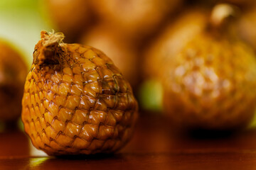 Wall Mural - Wild salak fruit on wooden table