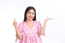 Asian Woman Who Has Long Black Hair Is Acting Hand As Good Symbol And Another Hand Presenting Something On The White Background.