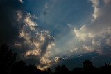 Fototapeta Tęcza - Clouds and sunrays in the sky