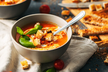 Wall Mural - Tomato soup. Tomato creme with basil and bread.  Bowl with italian tomato soup. 