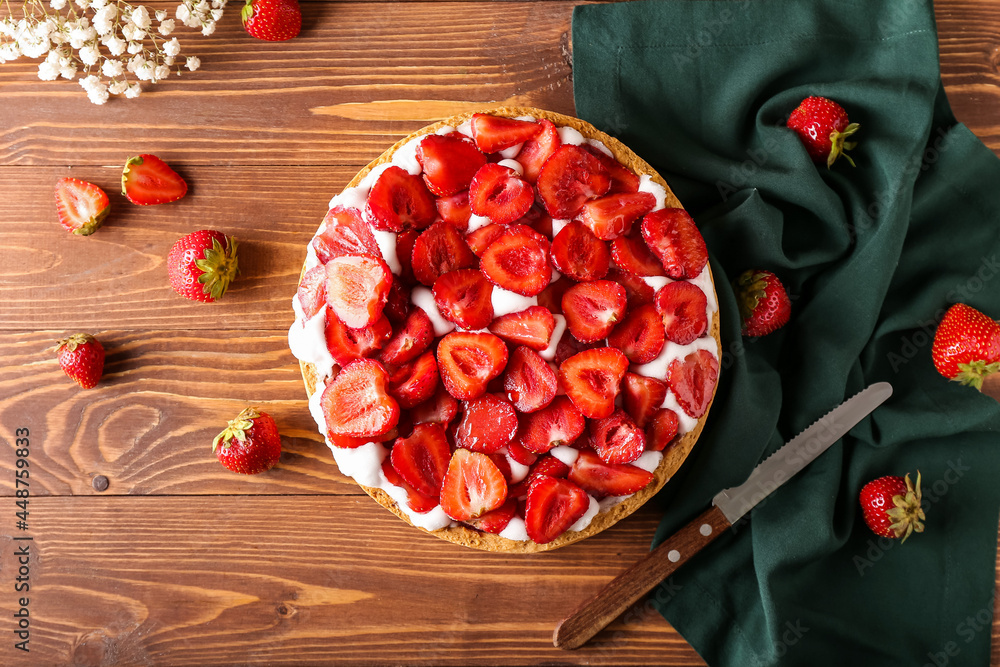 Composition with tasty strawberry pie on wooden background