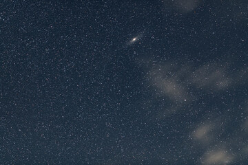 Wall Mural - deep space, bright andromeda galaxy on starry sky. science, cosmos. astronomical background.