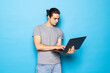 © F8  \ Suport Ukraine - Man in casual clothes with laptop on color background