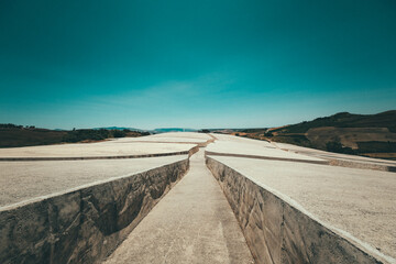 Narrow road under the blue sky