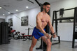 © Ivi - Powerlightss - frontal portrait of a sportsman working out in the gym without a shirt