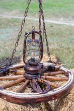 Decorative Chandelier From A Trolley Wheel With Chains And With Concealed Wiring In A Village Courtyard, Ukraine