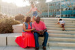 © Erin Brant/Stocksy - Parents with daughters outdoors on steps