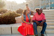 © Erin Brant/Stocksy - Happy Black family sitting in sunshine