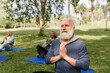 © McKinsey Jordan/Stocksy - Man Meditates With His Senior Yoga Group