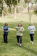 © McKinsey Jordan/Stocksy - Senior Women Practice Martial Arts in the Park