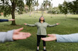 © McKinsey Jordan/Stocksy - Woman Breathes Deeply During Group Yoga Stretch