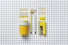 Yellow coffee cup and office accessories